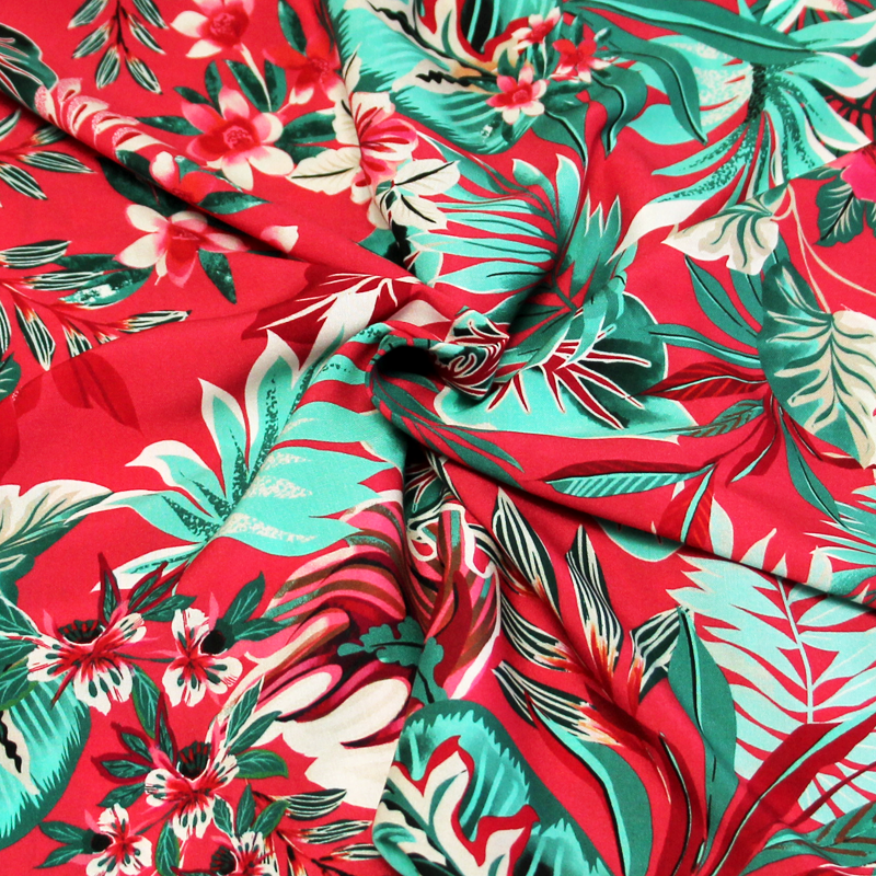 Étoffe 100% viscose - Feuillage tropical vert fond rose