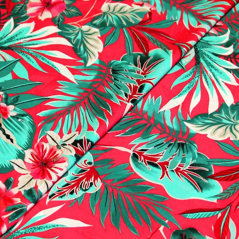 Étoffe 100% viscose - Feuillage tropical vert fond rose