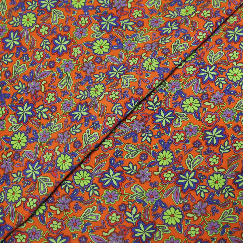 Étoffe 100% viscose - Fleur violette fond orange