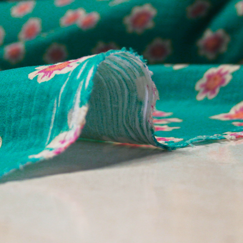 Double gaze 100% coton - Fleurs de cerisier fond vert