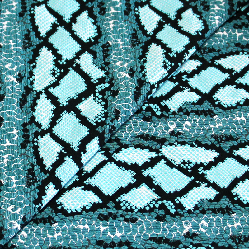 Jersey jacquard - Motif turquoise fond noir