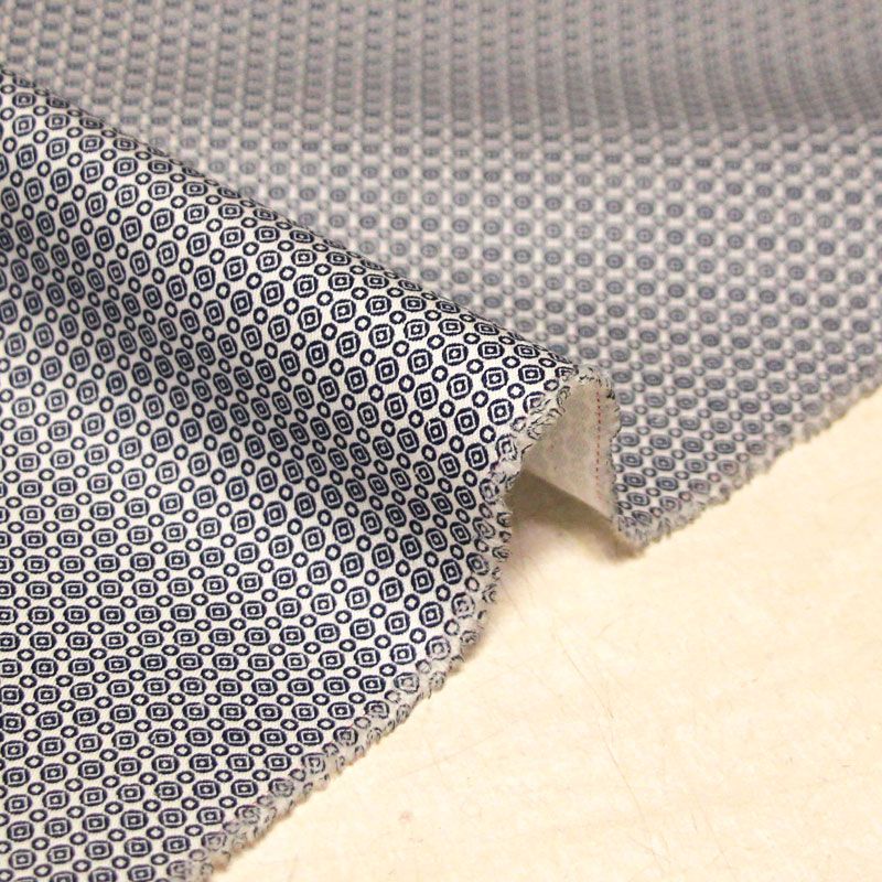Gabardine 100% coton - Motif géométrique marine fond blanc