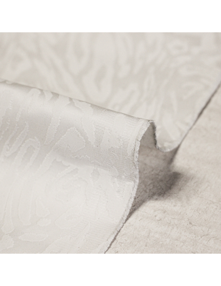 Gabardine floquée coton & élasthanne – Motif animalier blanc ton sur ton