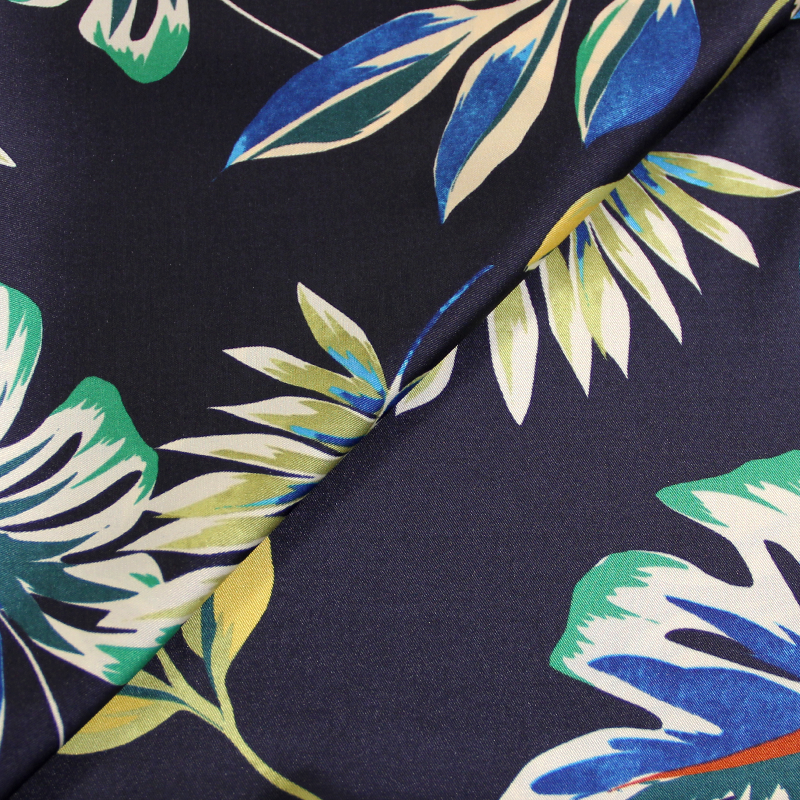Twill polyester imprimé - Feuilles tropical fond bleu nuit