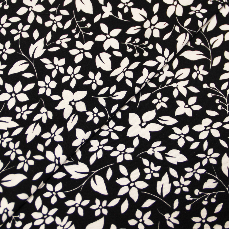 Toile de viscose imprimée - Fleurs blanches sur fond noir