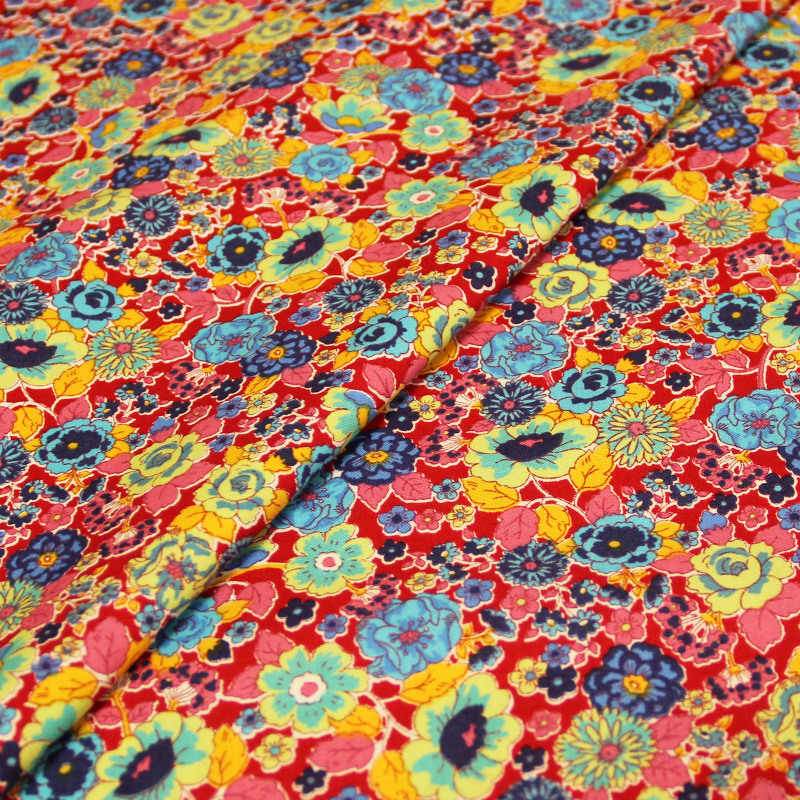 Popeline 100% coton imprimée - Fleurs multicolore fond rouge
