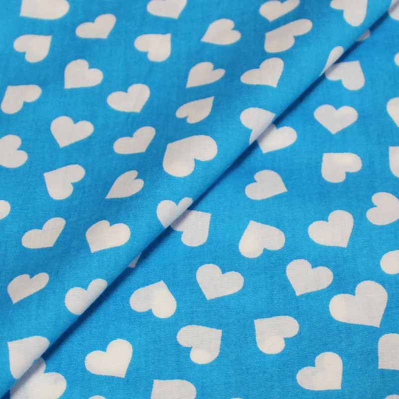 Popeline 100% coton imprimée - Coeur blanc fond bleu