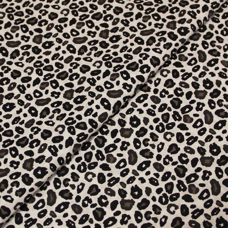 Toile de coton imprimée - Léopard noir et taupe fond blanc