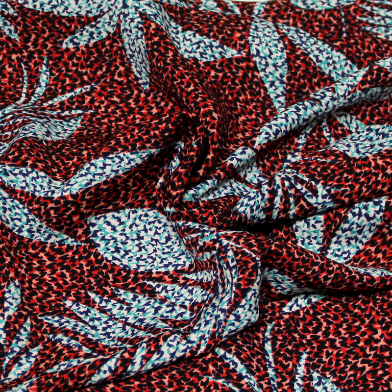 Javanaise - Palme bleu/vert fond tacheté rouge