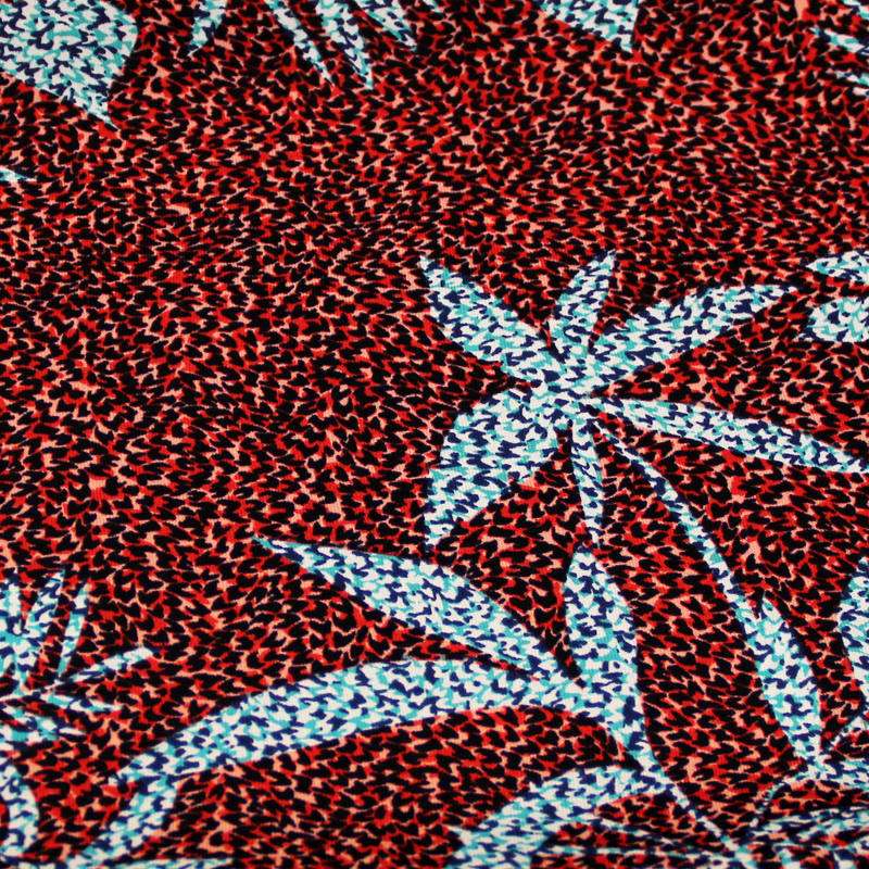 Javanaise - Palme bleu/vert fond tacheté rouge