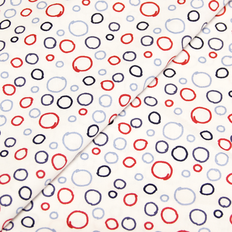 Popeline 100% coton - Dessin cercle camaïeu de bleus et rouge fond blanc