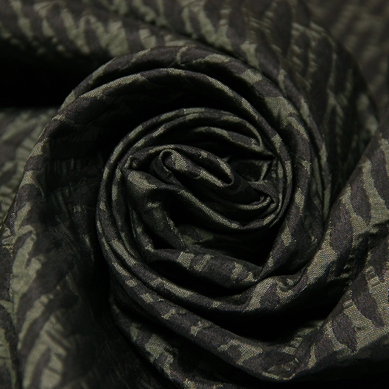 Tissu broché - Motif abstrait noir & vert