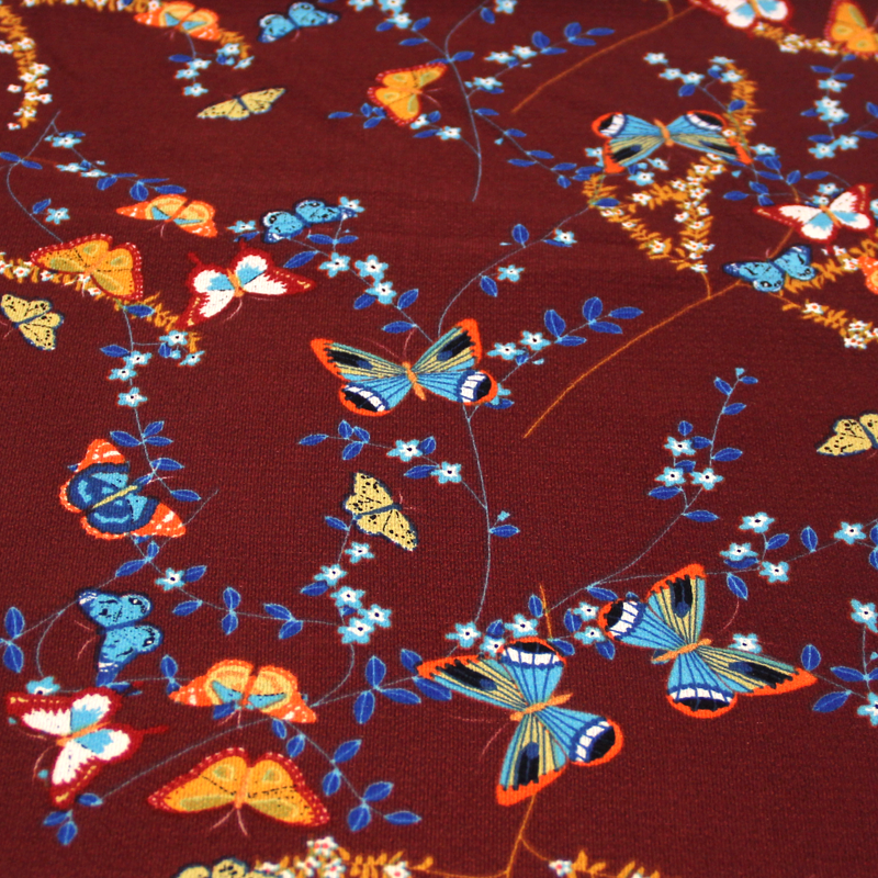 Crêpe bubble - Papillon fond bordeaux