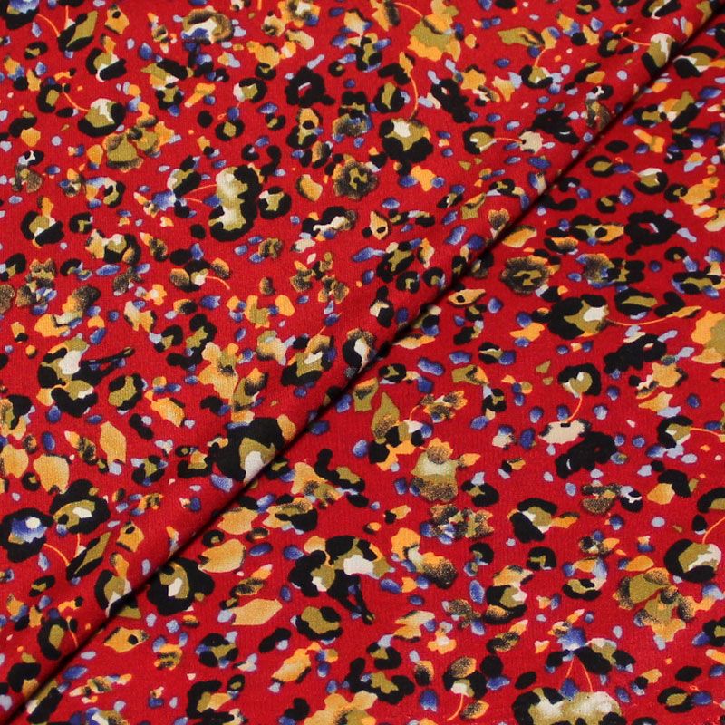 Javanaise - Tacheté multicolore fond rouge foncé