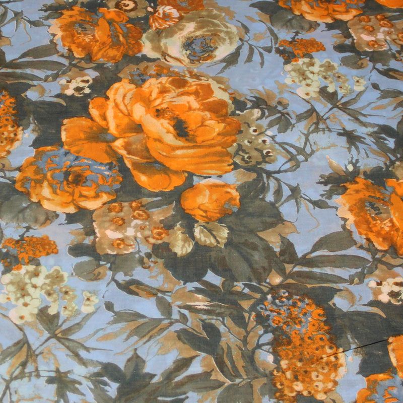 Batiste 100% coton - Grosse fleur orange fond bleu