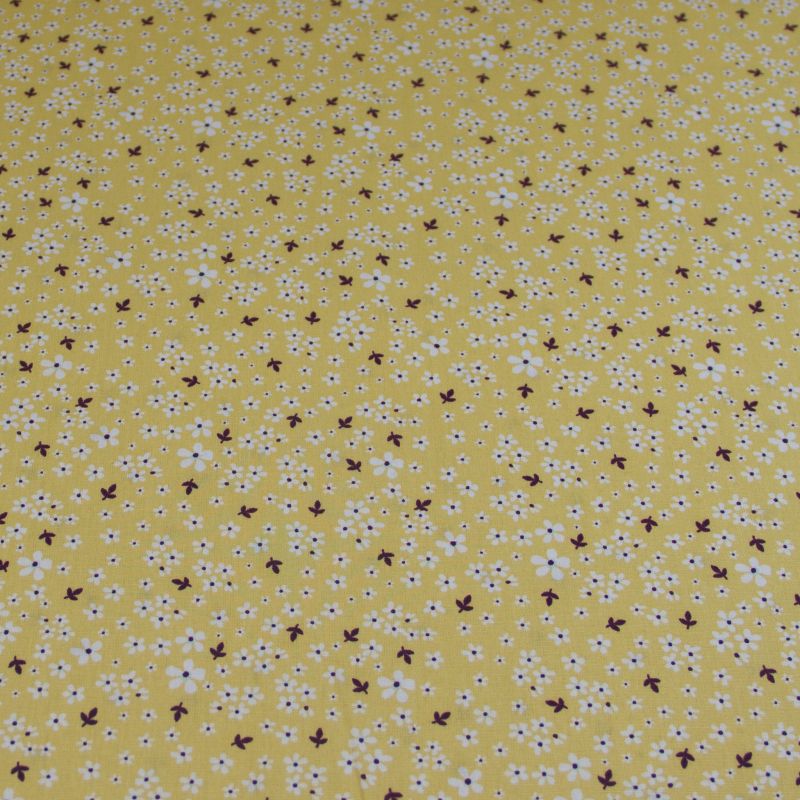 Popeline 100% coton bio (GOTS) - Petites fleurs blanches fond jaune