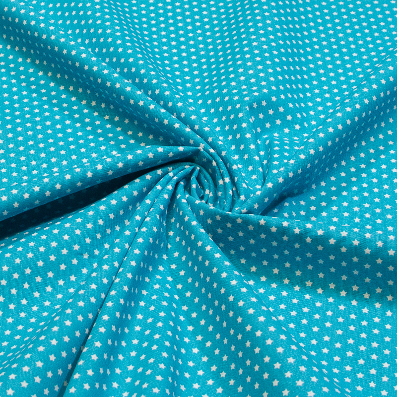 Popeline 100% coton - Étoiles blanches sur fond turquoise