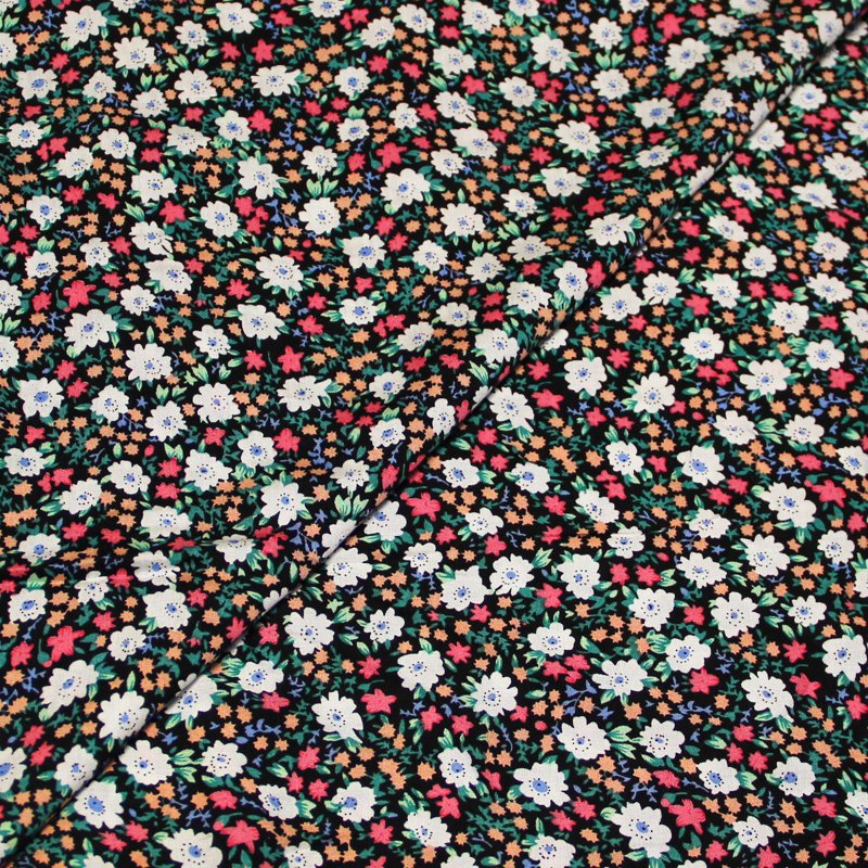 Toile 100% viscose - Fleuri ciel sur fond noir fleuri multicolore